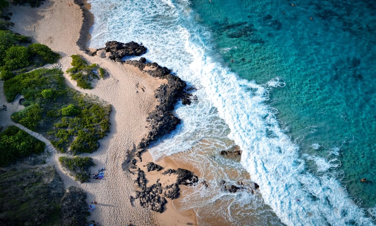 a beach with a sandy beach and a blue sky