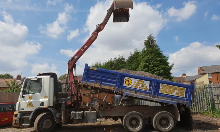 CMR grab lorry loaded with gravel on construction site in Dudley