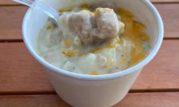Chowder Tots, golden tater tots and clam chowder in a cup with cheddar cheese from Captain’s Galley