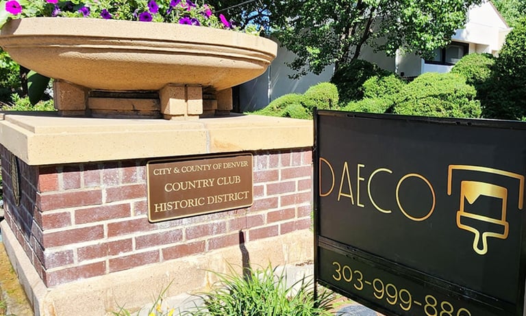 a fountain fountain with a fountain in front of a brick building
