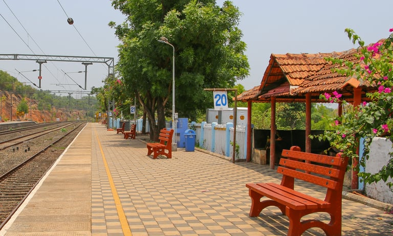a bench with benches in front of a thivim train station