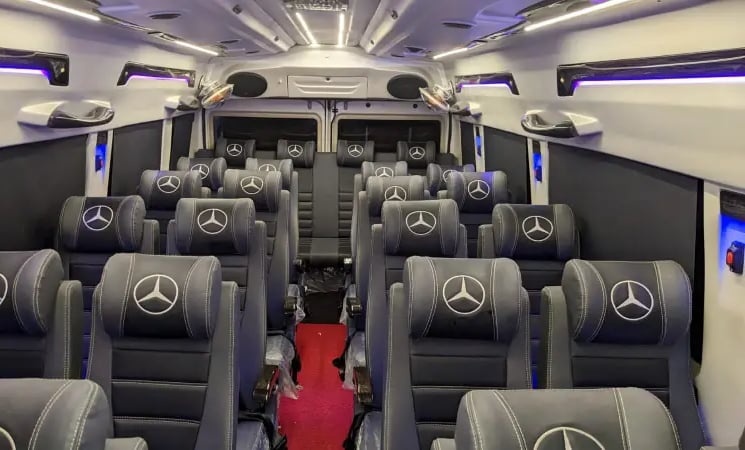 26 seater luxury tempo traveller interior on rent in Delhi for weddings and large group travel
