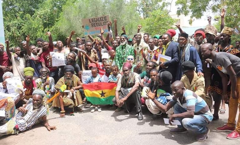 a group of people standing around a man holding a flag