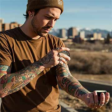 Alex - young Denver tattooed guy - puts Bee's Ink Armor/BIA on his fresh tattoos