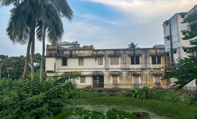 Kalidaha Gohaldaha R.M. High. with pond and trees.