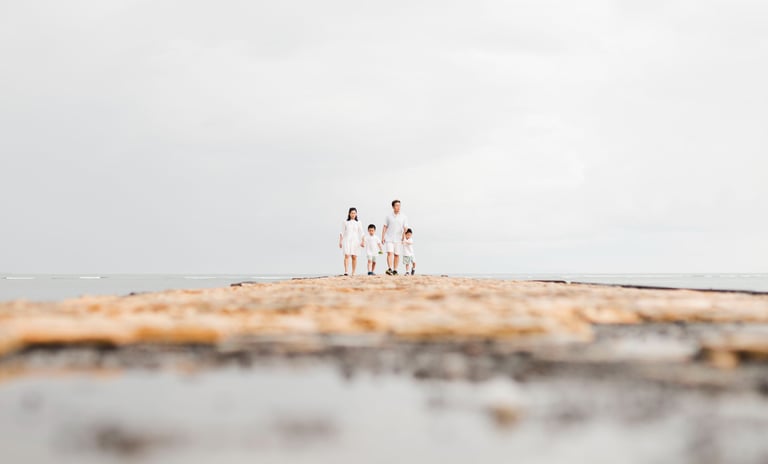 luxury family photographer in Bali capturing a quiet coastal moment at Conrad Bali