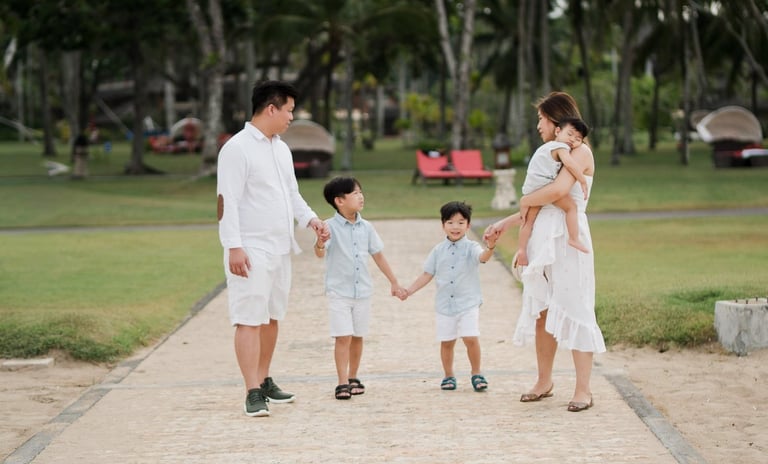 Family walking together at The Laguna Bali resort during a destination family photography session