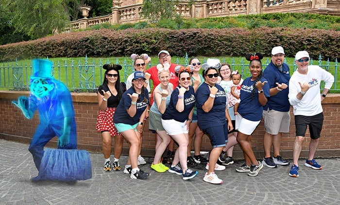 Minnie's Travel Boutique pictured with a hitchhiking ghost in front of the Haunted Mansion at Disney's Magic Kingdom® Park.