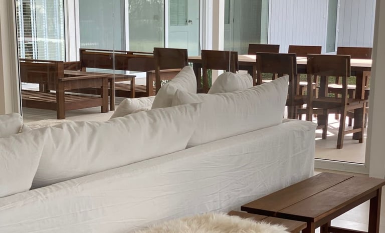 a couch with a basket bag on top of it