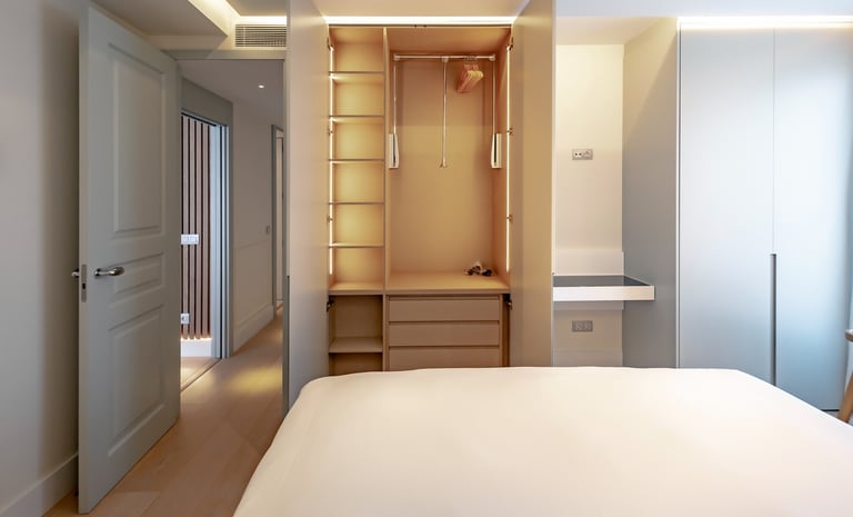a bedroom with a bed and a closet