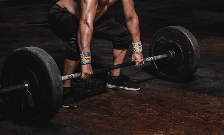 Lifting weight bar at gym