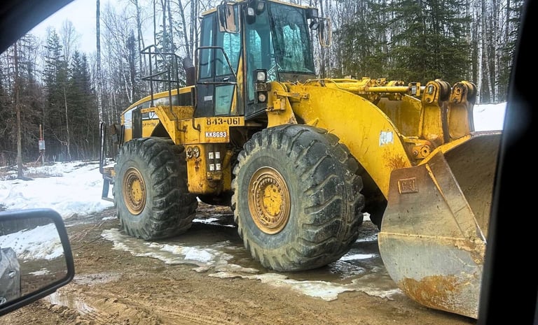 CAT Frontend Loader Works on Snowy Job Site In Houston Alaska