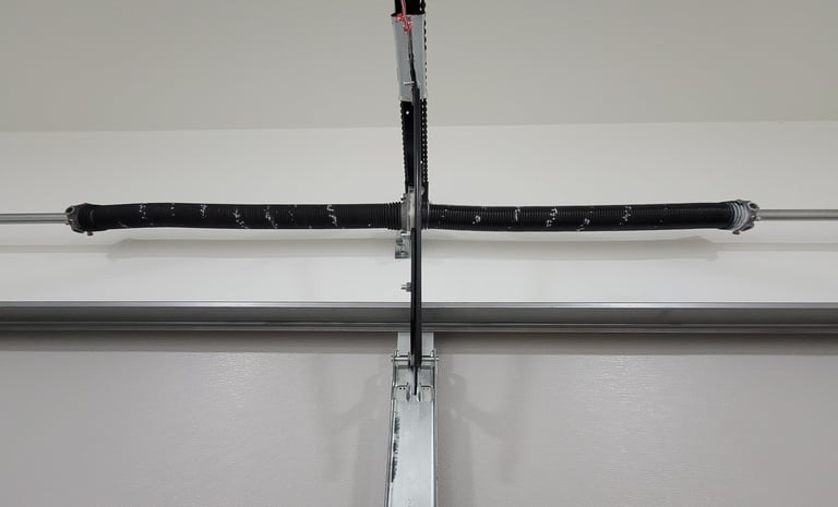 modern torsion garage door opener system installed by On Point Overhead doors in Bastrop TX