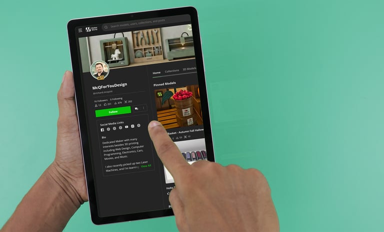 Person browsing a 3D modeling profile on a digital tablet with a green background.