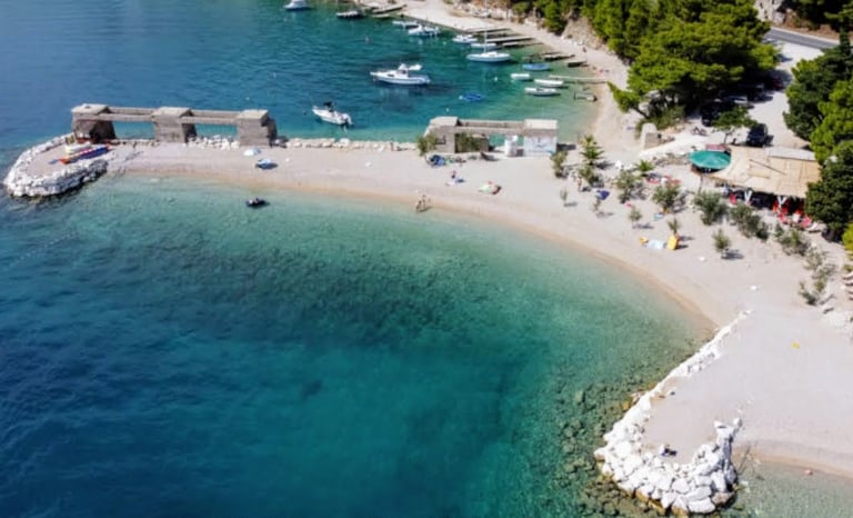 The photo shows the entirety of Rape Beach, one of the best family beaches around.