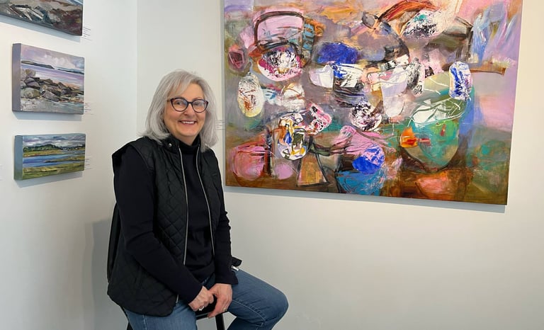 Paulette Melanson in front of her artwork at Gallery on Lincoln (photo credit: Lunenburg Barnacle)