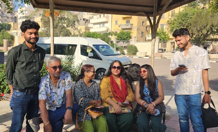 a group of people sitting on a bench in a park