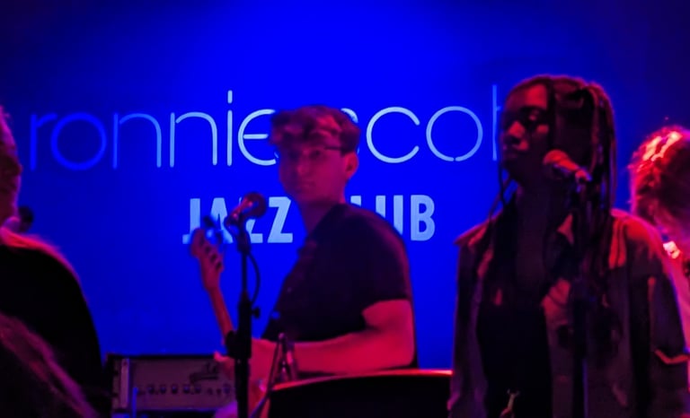 An image of Jamie Walker playing Electric Bass at Ronnie Scott's Jazz Club in London