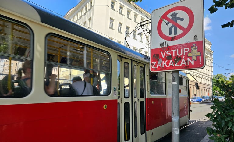 a bus stop sign on a city street