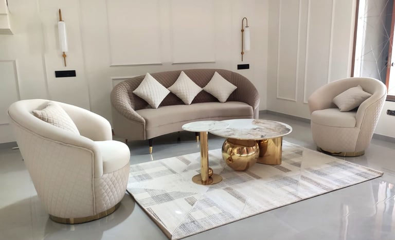 Living room interior design with three seater couch sofa two chairs. marble centre table neoclassic