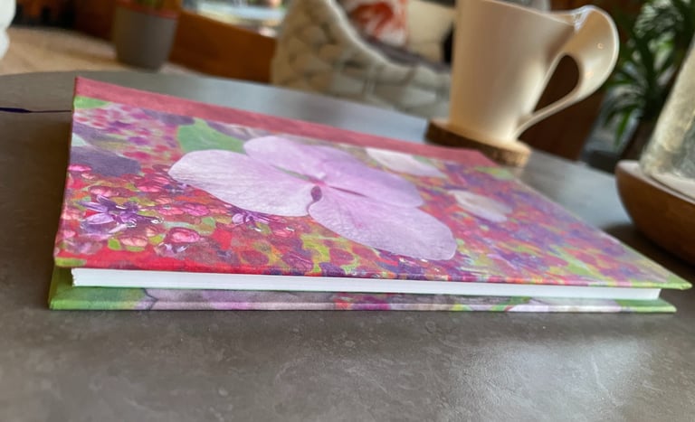 a flowered notebook on a table
