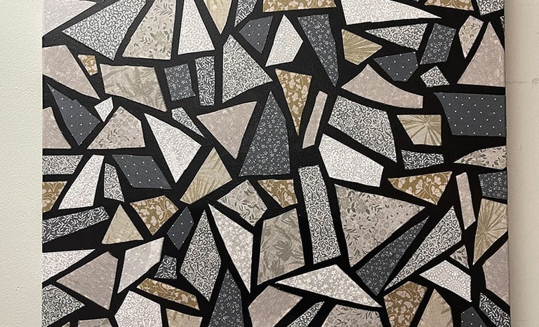 a canvas of a black and white mosaic tile using fabric