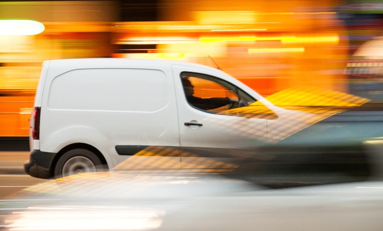 white cargo van on hot shot trucking run for urgent delivery