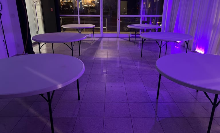 Empty venue with six round tables