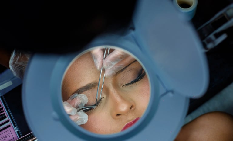 a woman is shown in a mirror and is looking at her eyeliners