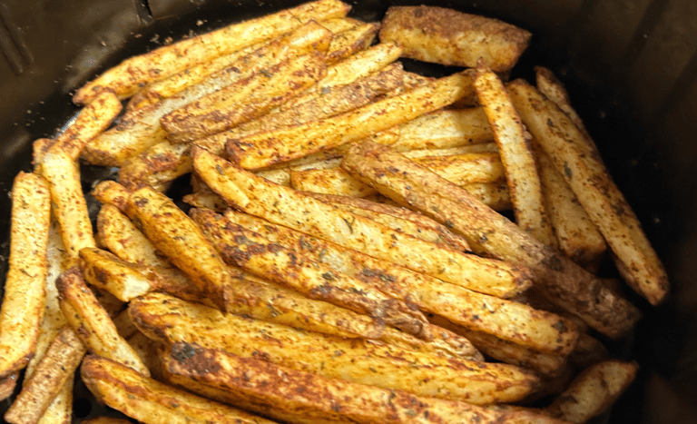 Seasoned air fryer fries, cooked and ready to eat.