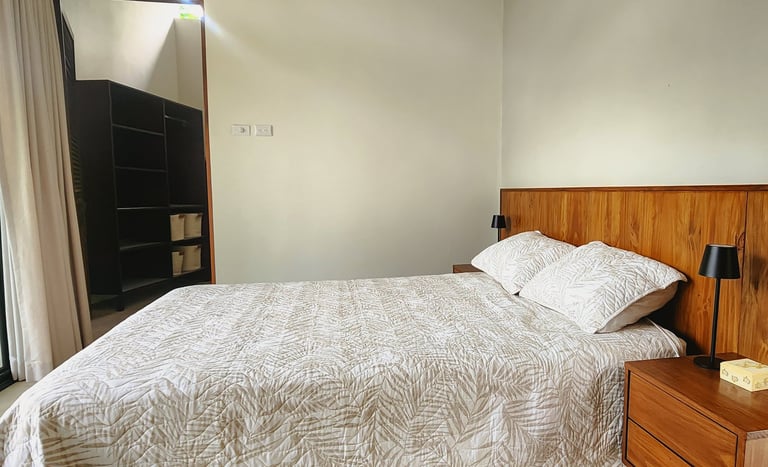 a bed with a private bathroom