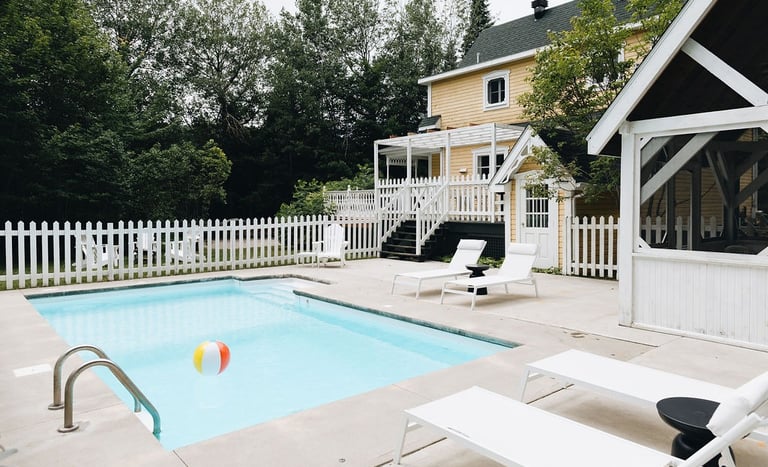 a pool with a beach ball in the middle of the pool