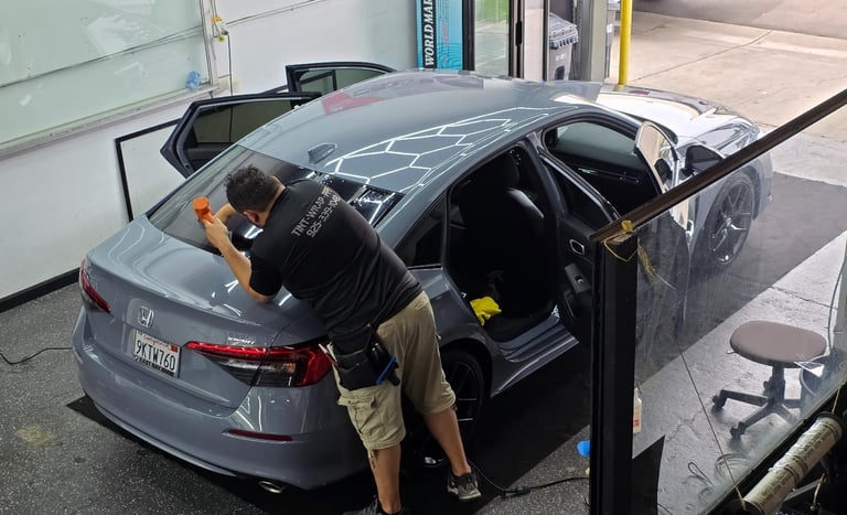 Ceramic window tint installation on a black luxury sedan in Livermore CA