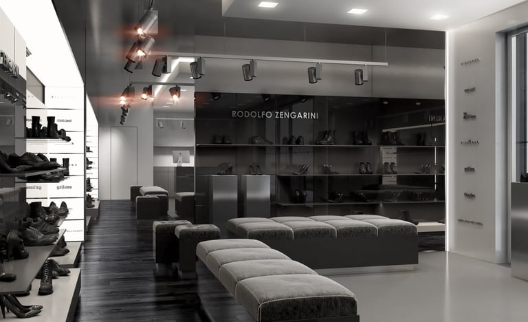  Dark-toned shoe/fashion store — "Rodolfo Zengarini" branding, black leather seating, spot lighting,