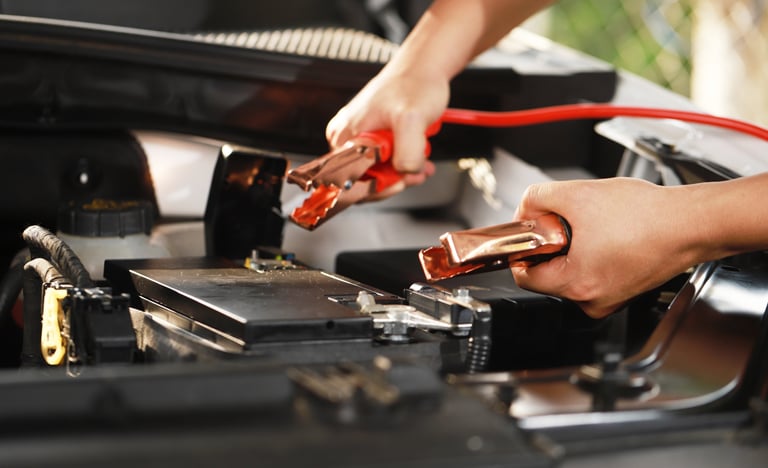 a person is holding a battery and a jump up in the air