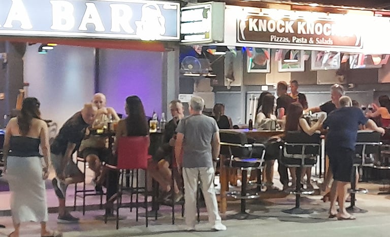 Thai women and customers outside bars on Soi 94 in Hua Hin