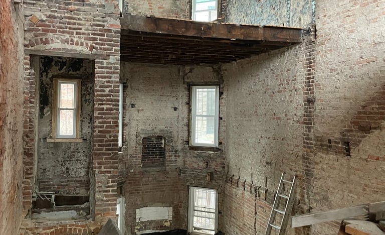 a room with a lot of wood and a ladder