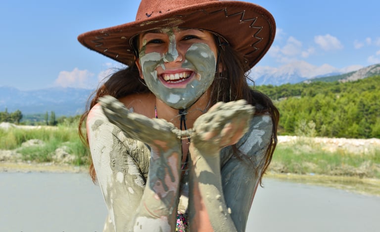 a woman having a mud bath in one of the best places to visit in Dalyan