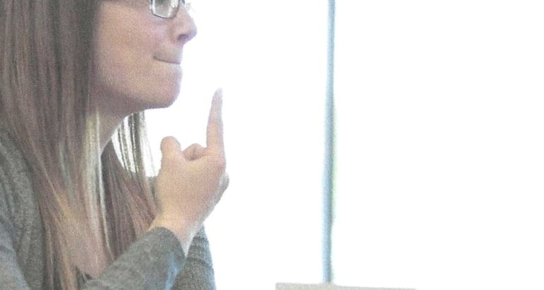 a speech and language pathologist with a client.