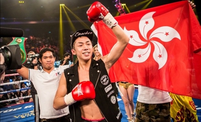 Photo of Hong Kong boxer Rex Tso in front of a Hong Kong flag