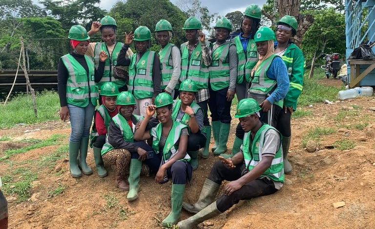 a group of people in green vests and safety vests