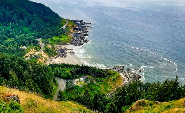 Oregon Coast - View from the mountain of Waldport and a beach surrounded by green forest