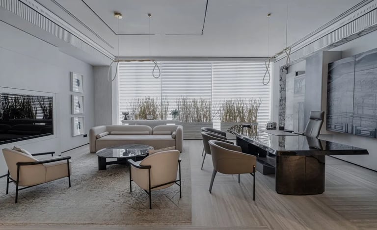 Modern luxury executive office interior with a black marble desk, cream lounge chairs, and minimalis