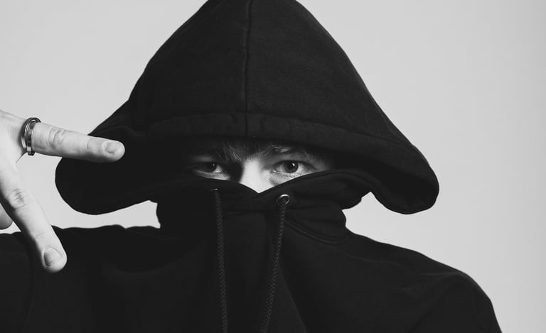 portrait of a man in a black hoodie with a hoodie on