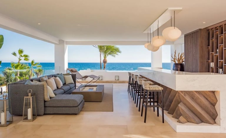 Covered terrace lounge and bar overlooking the Mediterranean