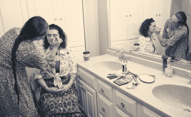 a woman in a floral dress is having makeup and getting ready to be a bride