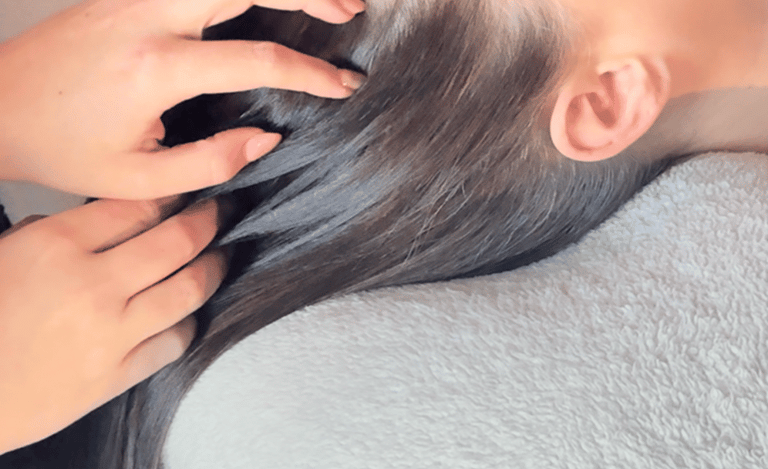 woman having hair stroked