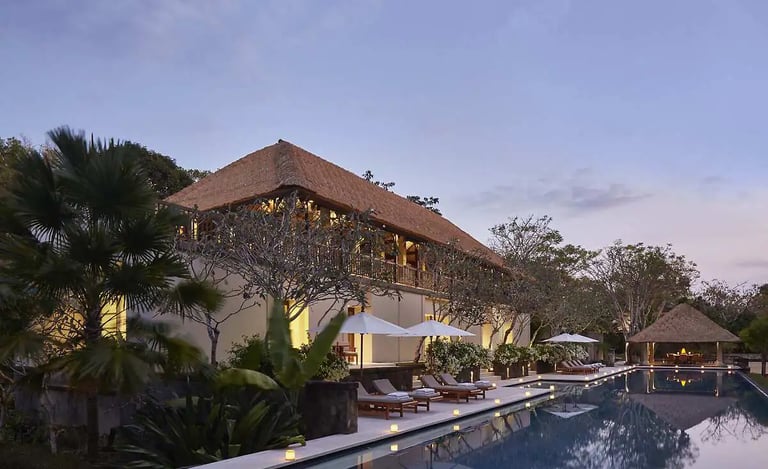 Luxury Aman Villa at Nusa Dua, Bali, featuring a private infinity pool, tropical garden, and modern Balinese architecture 