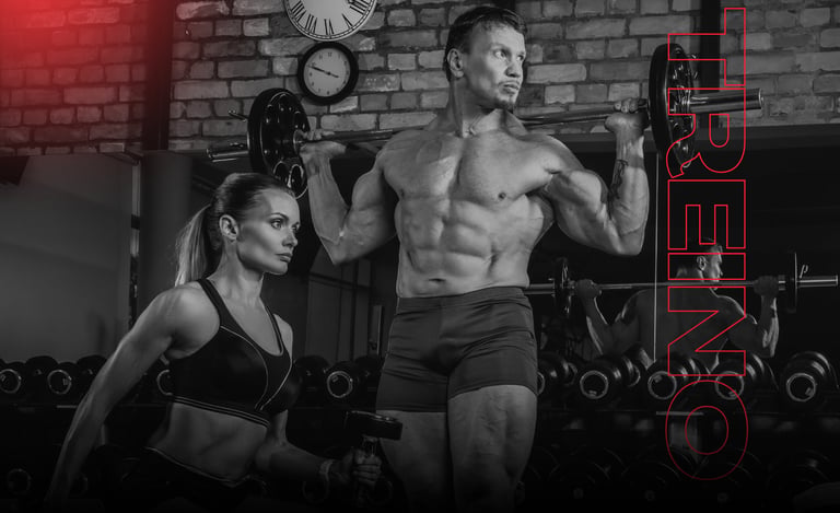 Muscular bodybuilder performing barbell squats next to a female athlete in a gym during a heavy weightlifting workout.
