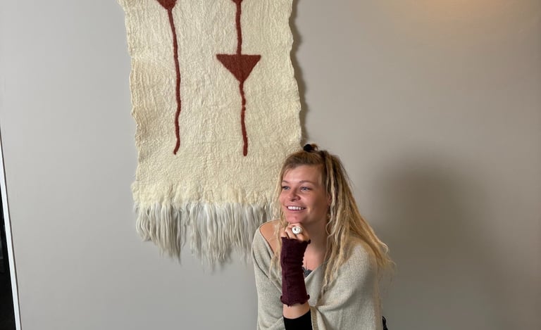 wool wall hanging felted tapestry women sitting on chair tribal pattern